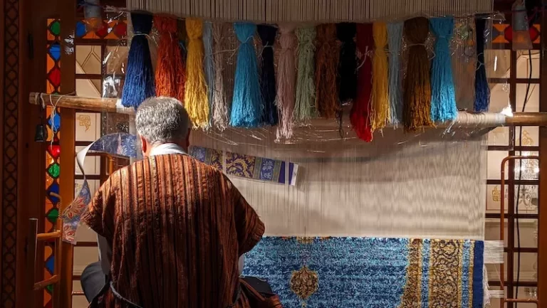 A man who weaves carpets in Iran