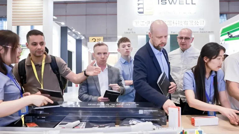 Buyers interacting with exhibitors and exploring window covering products at R+T Asia trade show