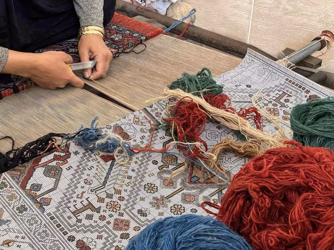 Qashqai rugs displayed in Vakil Bazaar, Shiraz – traditional Iranian handicrafts