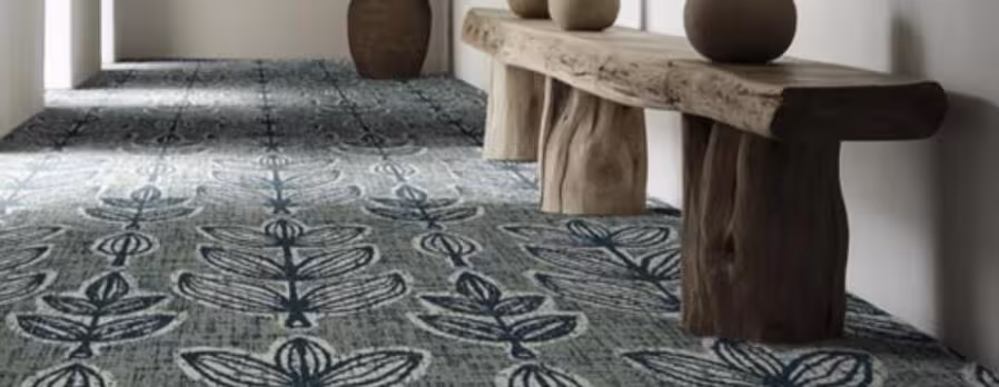 Tarkett Artisan Collection broadloom carpet inspired by handcrafted design, featuring earthy tones and natural patterns for warm hospitality interiors.