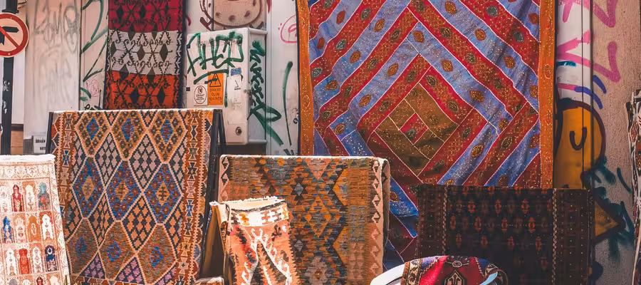Colorful Turkish Rugs Displayed on Street in Antalya