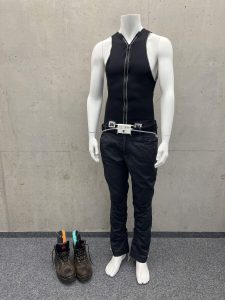 Smart industrial wearable garment displayed on mannequin featuring ergonomic textile technology, protective workwear design, and advanced wearable safety equipment for industrial environments.