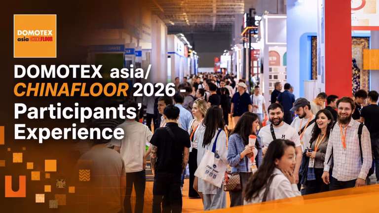 Participants at DOMOTEX asia/CHINAFLOOR 2026 exhibition sharing their experience in a busy trade show hall